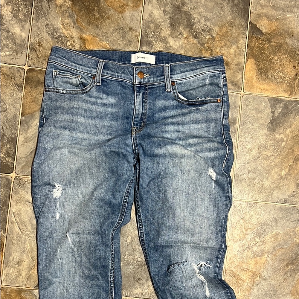 Level 99 loose fit size 28 light wash w rips